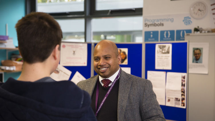 <p>&nbsp;Subject tutors speaking to prospective students and parents</p>