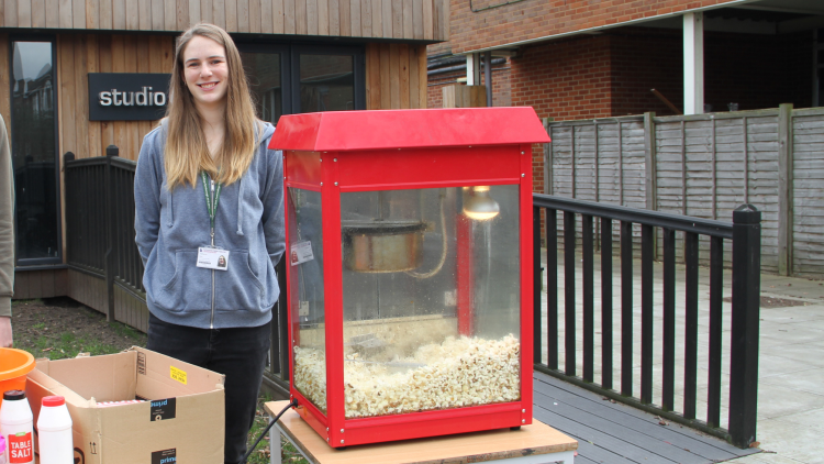 <p>Student Association member, Katherine Kerr, making fresh popcorn&nbsp;&nbsp;</p>