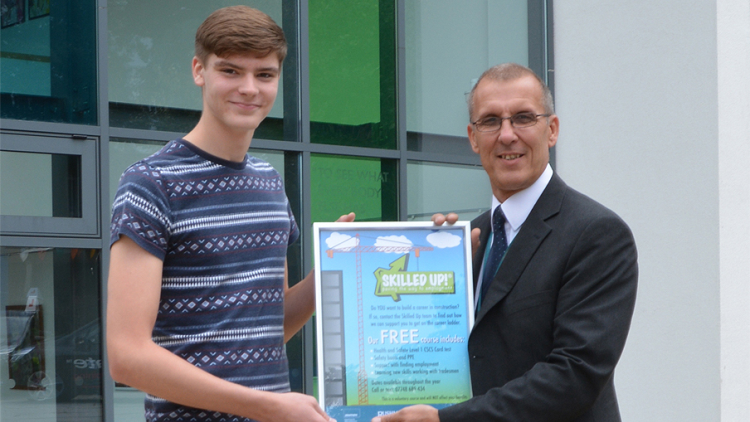 <p>Student Chris Lewis being presented with his framed poster by&nbsp;<strong><span style="font-weight: 400;">Principal Engineer, John Trusler</span></strong></p>