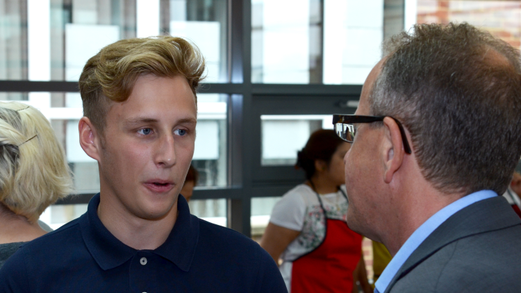 <p>Student William Lyddon speaks to Principal Simon Jarvis about his brilliant results</p>