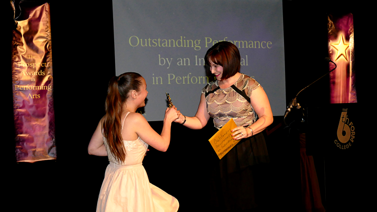 <p>Student Olivia Woodham receiving her award for Outstanding Performance by an Individual in Performing Arts</p>