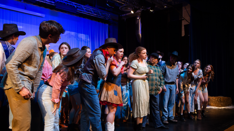 <p>Students performing a number from Oklahoma</p>