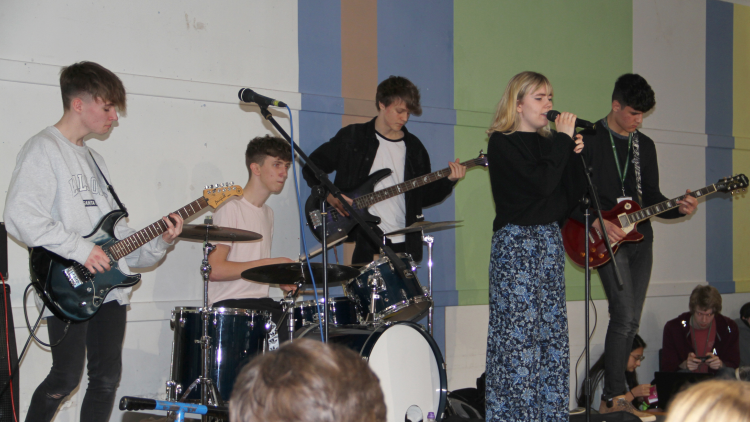 <p>A student band playing at a 'Live Lunch' to a packed Cafe Direct</p>