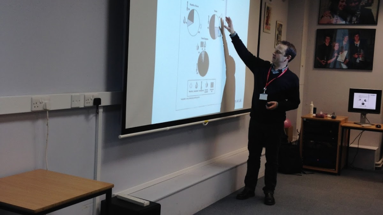 <p>James Green <strong><span style="font-weight: 400;">IELTS Manager at the University of Surrey giving a lecture at the College</span></strong></p>