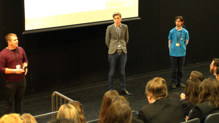 <p>&nbsp;Charlie Crumpton, Jamie Wilson and Barnabas Balint speaking to students about their visit to Auschwitz</p>